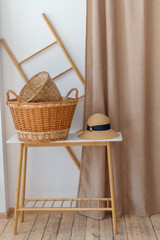 Fototapeta na wymiar Hat and basket on the wooden table