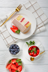 a slice of a pink strawberry cheesecake