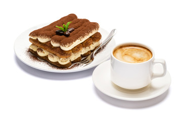 Classic tiramisu dessert on ceramic plate and cup of coffee isolated on white background with clipping path