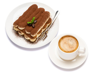 Classic tiramisu dessert on ceramic plate and cup of coffee isolated on white background with clipping path