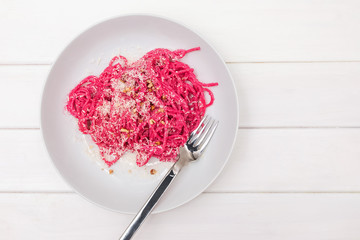 Spaghetti pasta with pink beetroot sause. Delicious lunch