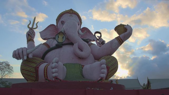 .Ganesha lord of success in sunrise..Ganesha Hindu God and the god of success in  Makha Bucha Buddhist memorial park at Nakornnayok province Thailand