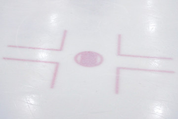 Ice hockey rink red centrla point lines.