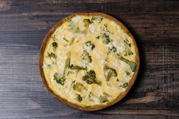 Appetizing kish with salmon, broccoli and feta cheese