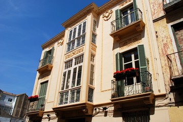 Fototapeta na wymiar City centre townhouses with ornate balconies, Malaga, Spain.