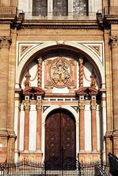 View of the Cathedrals Chain Gate door (Puerta de las Cadenas), Malaga, Spain.