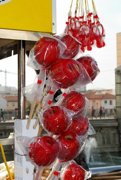 Toffee apples on a street stall, Malaga, Spain.