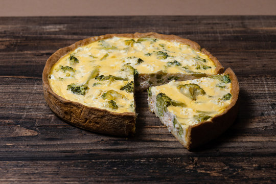 Appetizing kish with salmon, broccoli and feta cheese