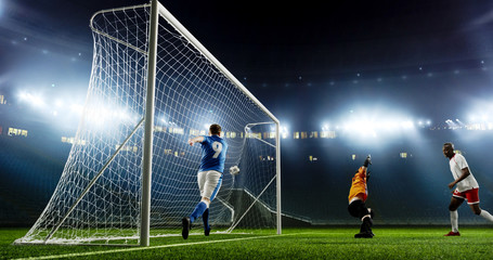 Tense game moment in front of the goal on the empty professional soccer stadium. No spectators on...