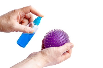 Spray bottle of disinfectant in man hands sanitizing coronavirus Microscope close up