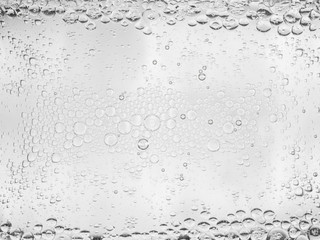 Close up of foam bubbles in water background.