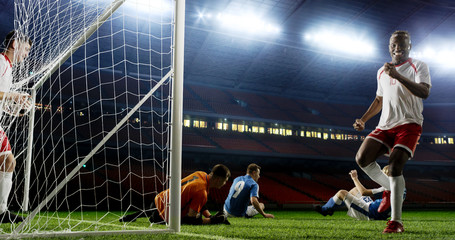 Tense game moment in front of the goal on the empty professional soccer stadium. No spectators on tribunes. Stadium is made in 3d.