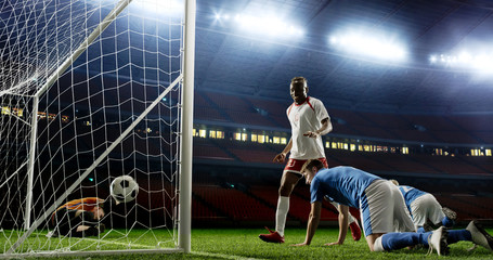 Tense game moment in front of the goal on the empty professional soccer stadium. No spectators on...