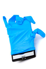 A metaphor for social communication hygiene - a smartphone in a latex glove.