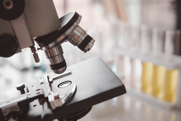 microscope and laboratory test tube , science research concept