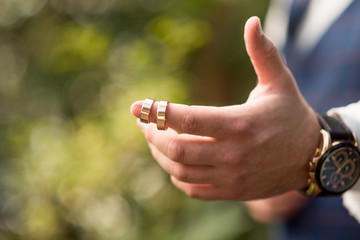 hand with finger on lips