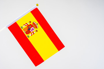 Spanish flag on a white background. Flag Of The Kingdom Of Spain. Red and yellow flag with the coat of arms of Spain. Official state symbol of Spain. Banners of the countries of the world.