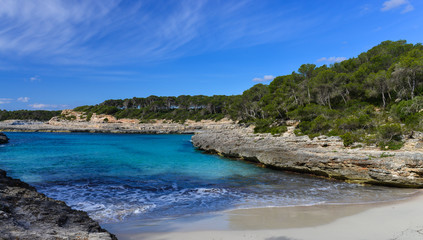 Fototapeta premium Turquoise waters of a bay in the Mondrago Natural Park, Mallorca, Spain