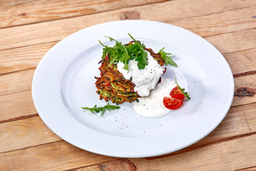 zucchini pancakes with sour cream and herbs