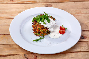 zucchini pancakes with sour cream and herbs
