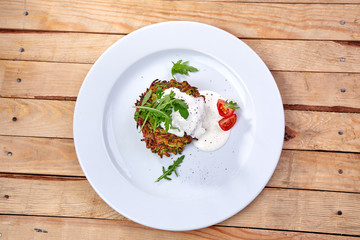 zucchini pancakes with sour cream and herbs