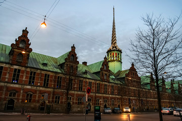 Obraz premium View to Borsen, building of Copenhagen Stock Exchange on the island of Slotsholmen. Copenhagen, Denmark. February 2020