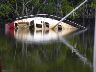 Fototapeta na wymiar sinking boat on river