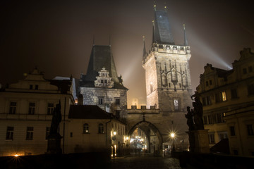 Fototapeta na wymiar Night view of the door of the Charles bridge going to the Mala Strana district of Prague