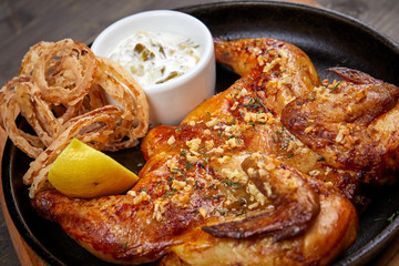 roasted chicken with sauce and lemon