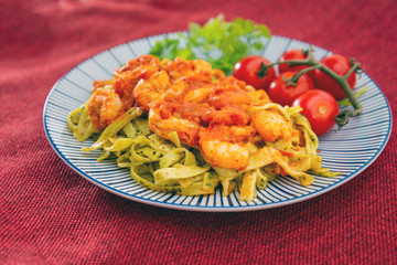 Small Gambas, stewed tomatoes, Tagliatelle with pesto