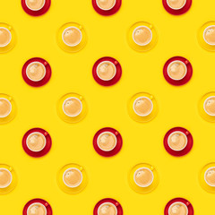 Colorful coffee cups pattern on yellow background