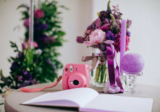 Pink Instant Film Camera At Wedding Reception