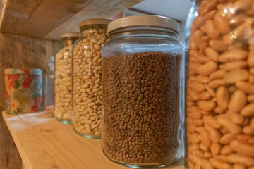 legumes in glass jars in a kitchen