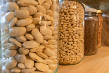 legumes in glass jars in a kitchen