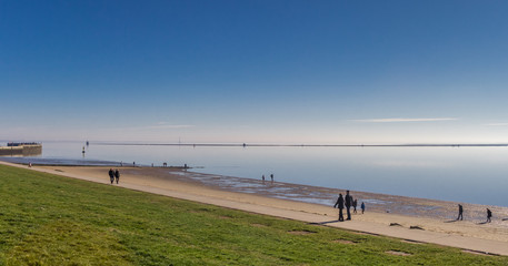 People walking on the beach in Wilhelmshaven, Germany