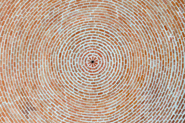 Beautiful bottom up view to the brick ceiling and antique chandelier. Texture of red brickwork. Rough surface. For background and design.