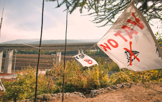 No tav flag in front of the tav high speed railway construction site in chiomonte, italy