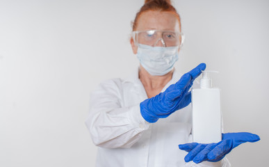 Sanitizer and liquid soap in the hands of a woman. Disinfection from viruses.