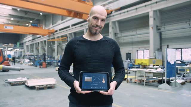 Proud Engineer showing custom app for business use