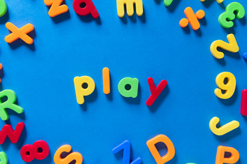Colorful children letters spelling PLAY
