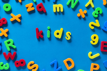 Colorful children letters spelling KIDS