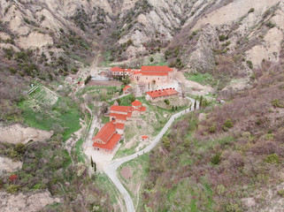 Fototapeta na wymiar Ancient mountain monastery in Mtsheta, Georgia - Shiogvime. Aerial view