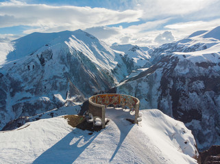 Russian - Georgian Friendship Monument and mountains, Georgia. Aerial view.