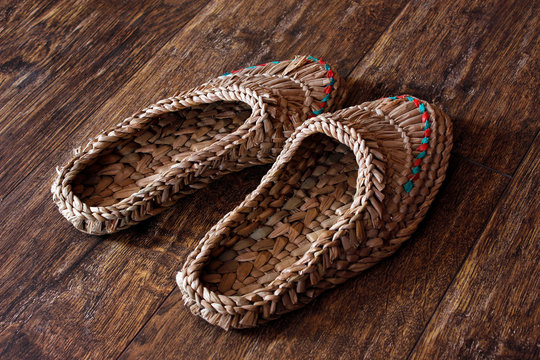 Wicker home low slippers, bast shoes or Lapti woven from wood bast. A modern version of old traditions.