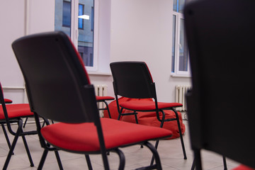 soft focus red chairs in hall interior indoor space without people