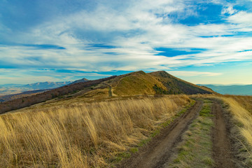 Carpathian mountain highland valley dirt trail route grass land scenic view nature environment