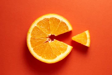Fotobehang Orange slice symbolizing vitamin c is eating the cut out piece on orange background © Cagkan