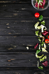 Tasty food background, food frame of green and red vegetables, healthy or vegetarian concept, top view, copy space.