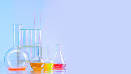 Flasks with multi-colored reagents. Flasks of different sizes in a chemical laboratory. Reagents...