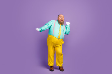 Full body photo of positive cheerful fat man enjoy dancing on discotheque wear turquoise shirt trousers white gloves isolated over vivid color background